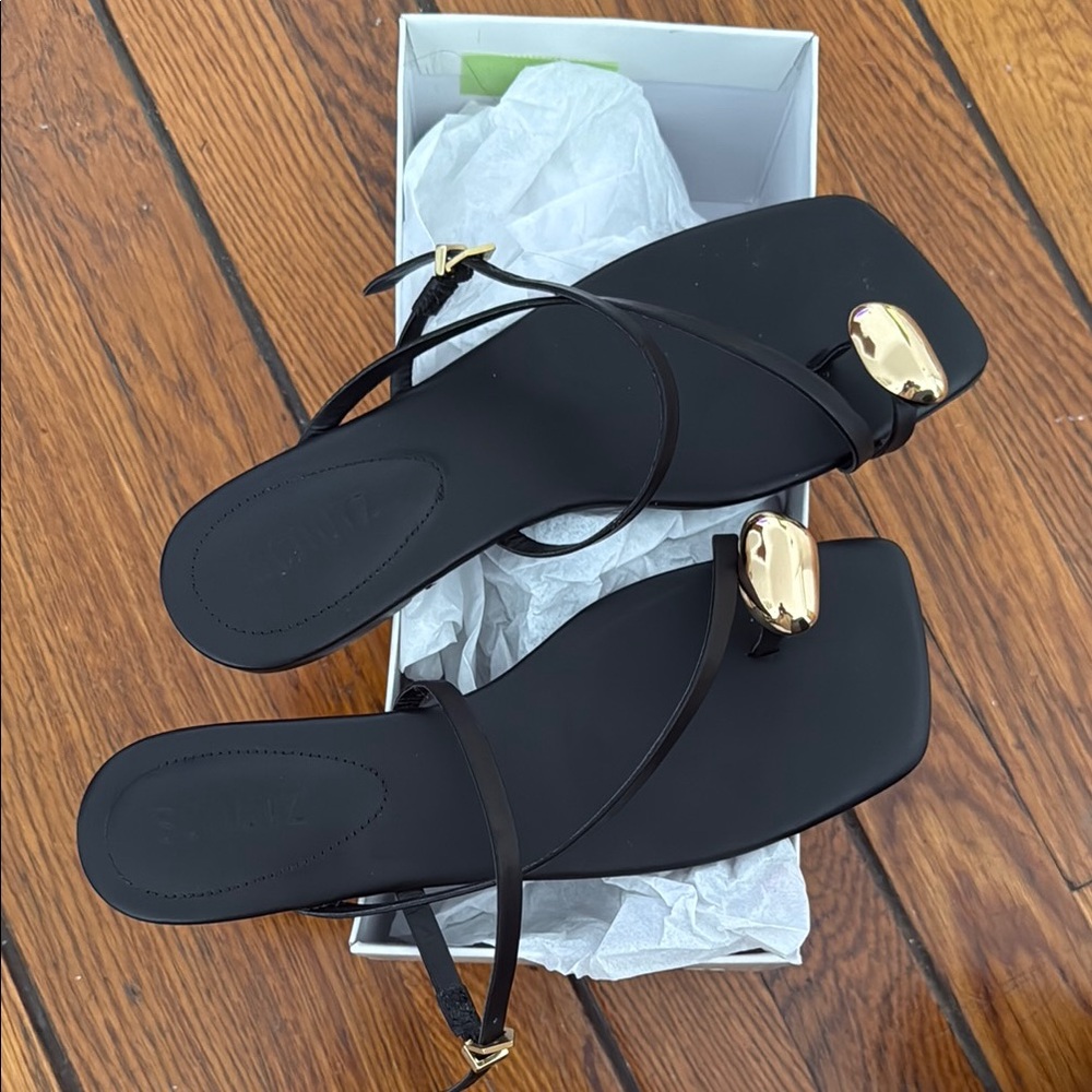 SCHUTZ Black and Gold Sandals Sleek Design
